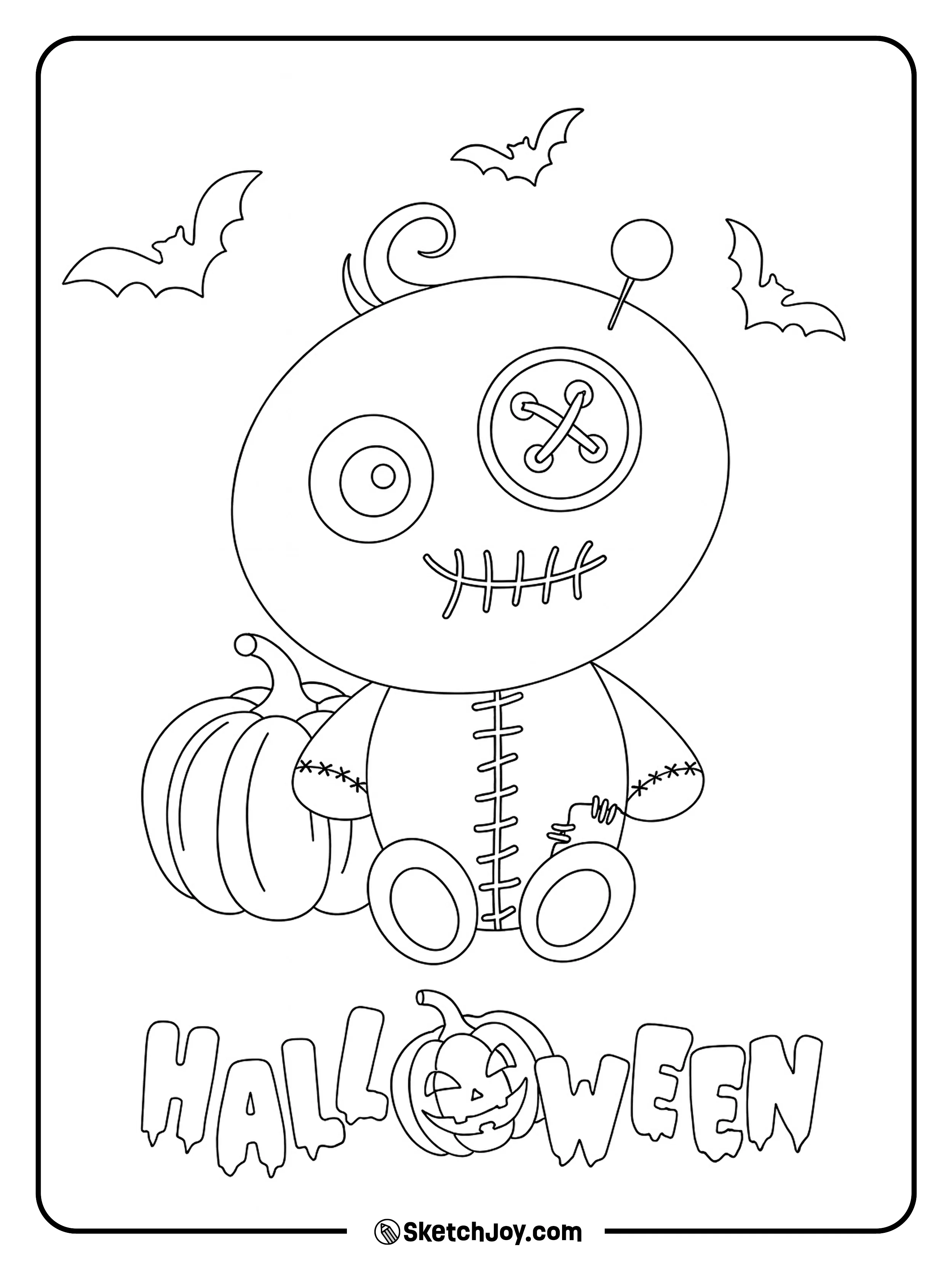 A stitched doll with button eyes and a patchwork body sits in front of two pumpkins