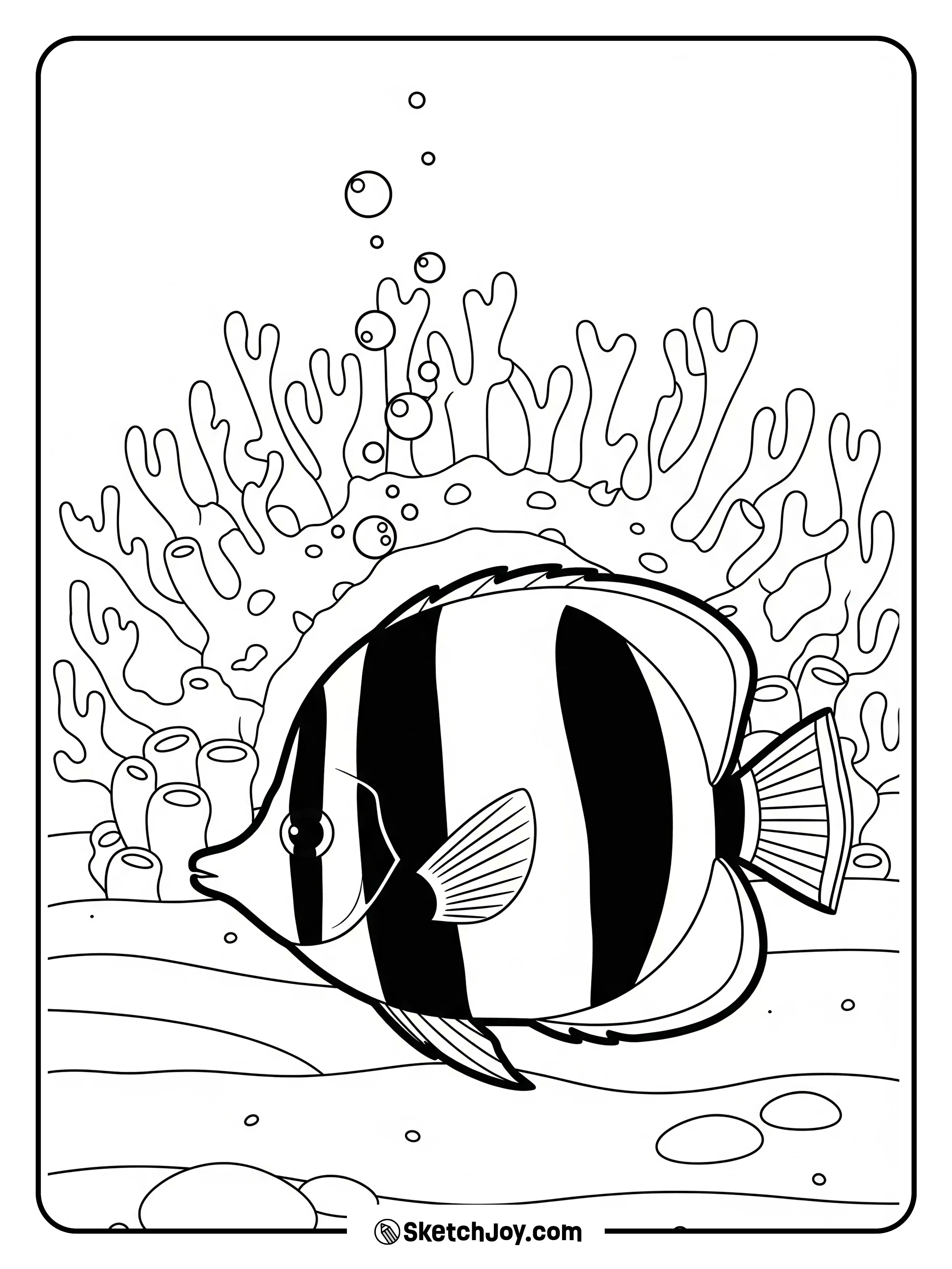 A butterflyfish passes a small coral arch.