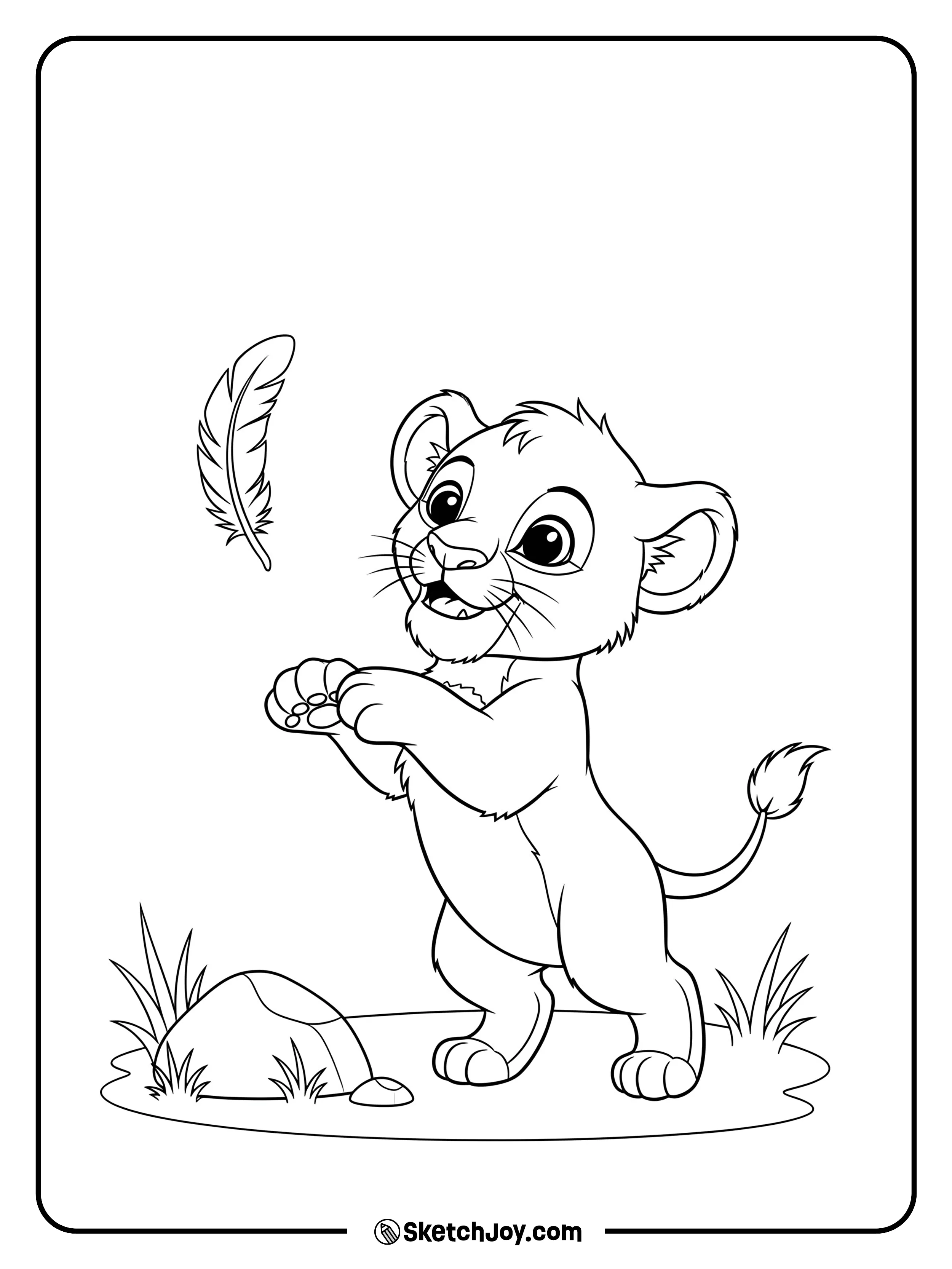 A cub bats at a falling feather near a smooth stone.