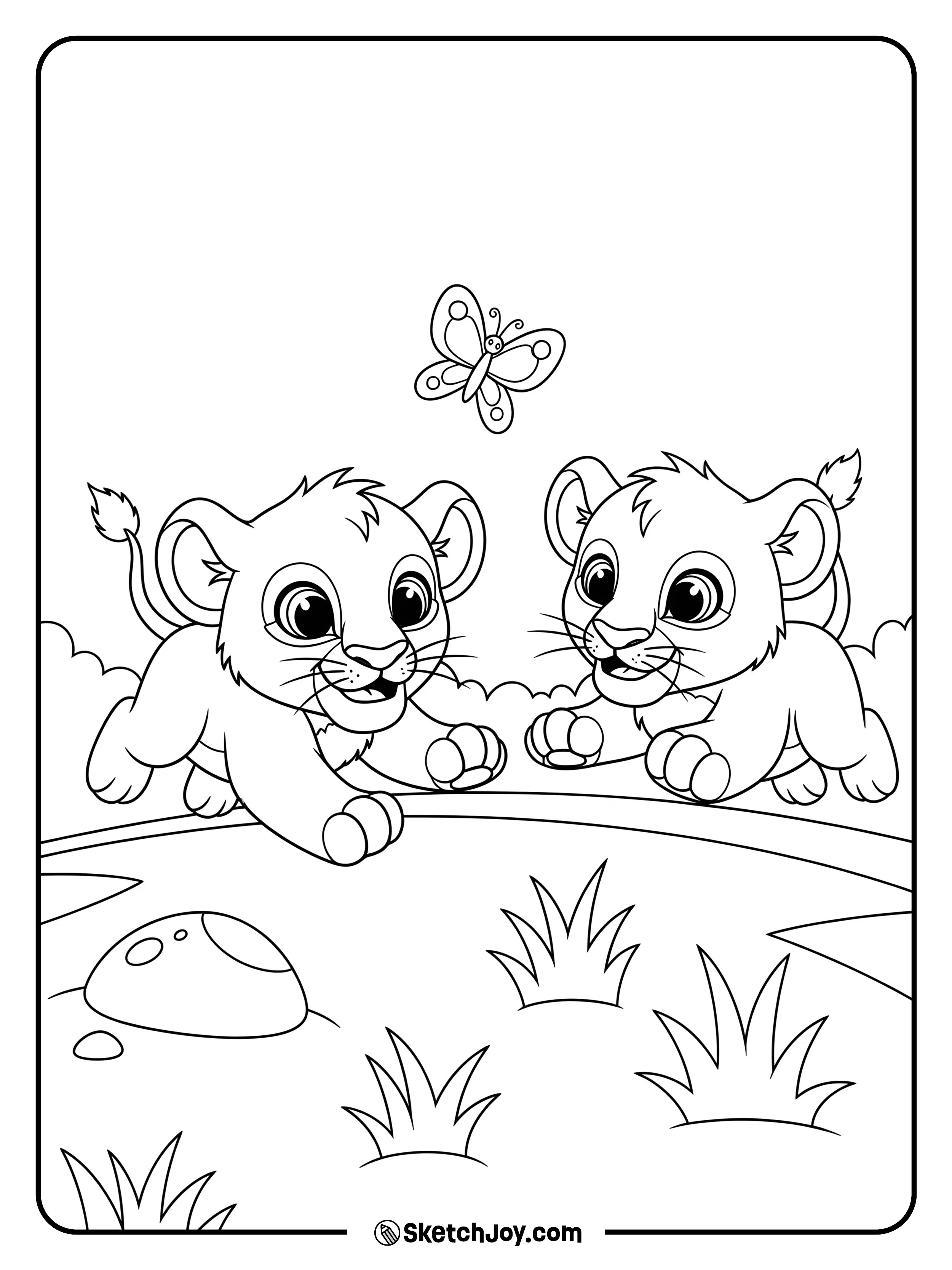 Two little cubs chase a butterfly near a small rock and grass tufts.