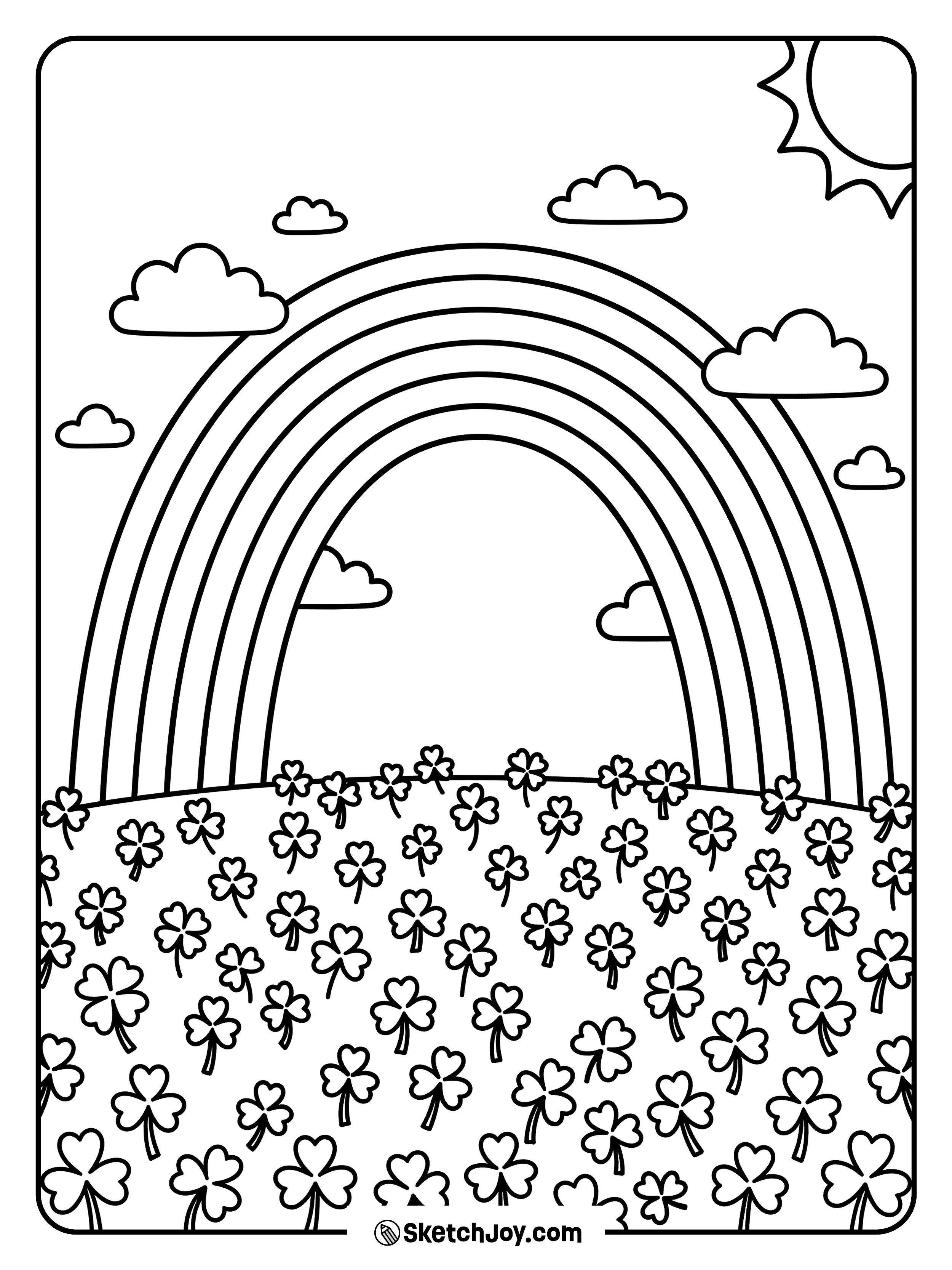 A bright rainbow landing right in a field full of lucky shamrocks.