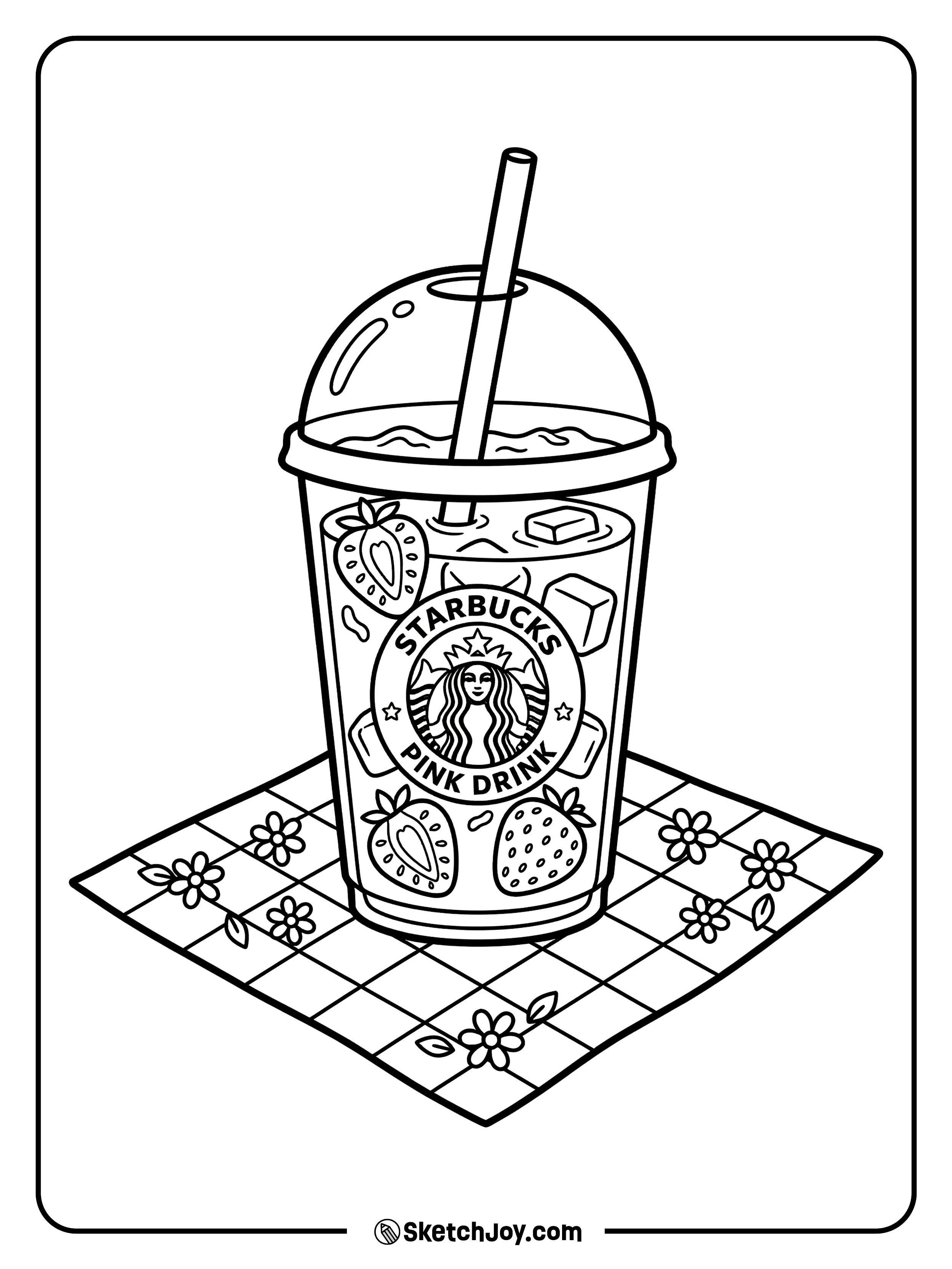 A pink strawberry drink sitting on a checkered picnic blanket in the grass.